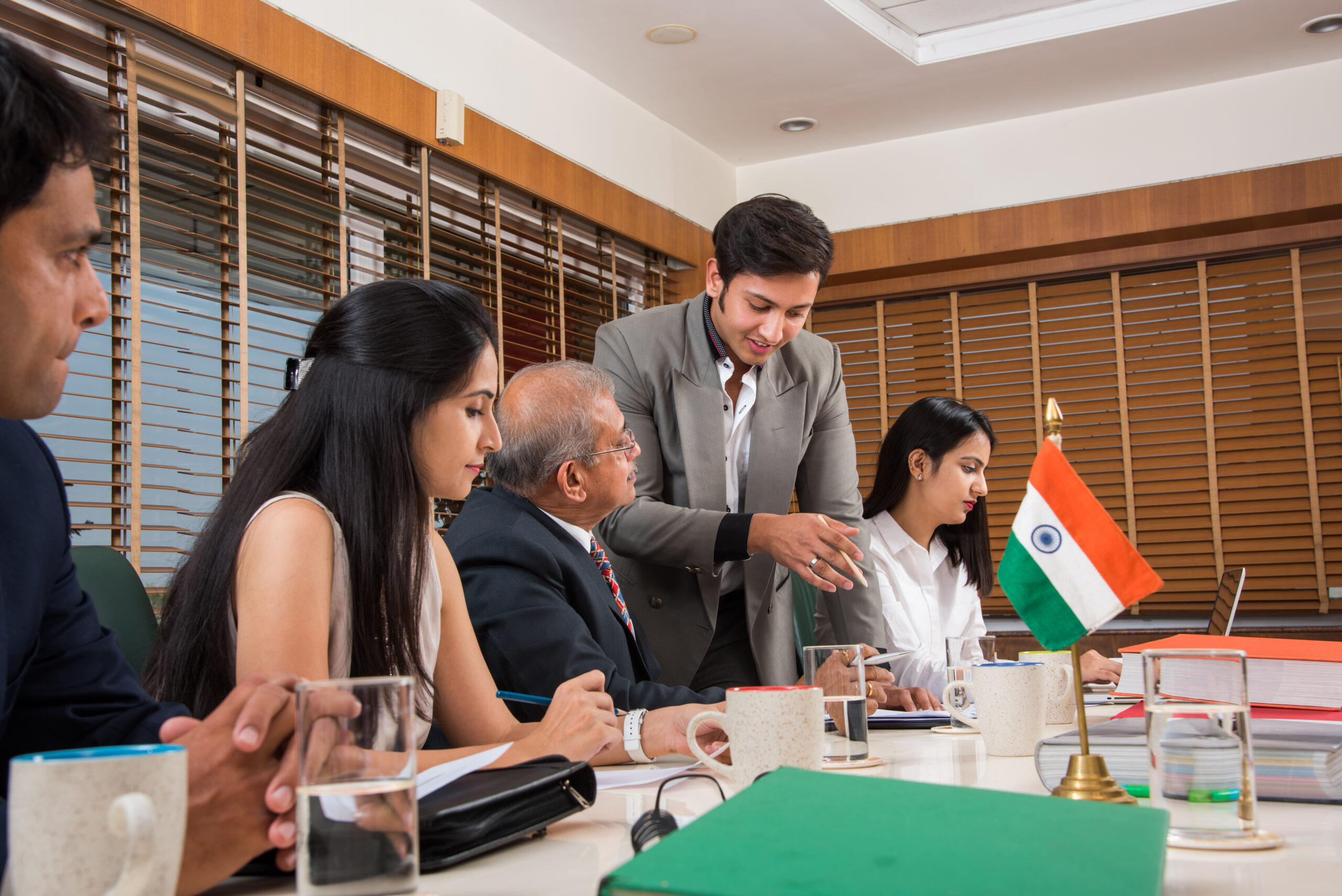 Asian Indian Business People or Corporate culture and Working in the office Concept with Laptop, papers, meetings, presentations and discussions